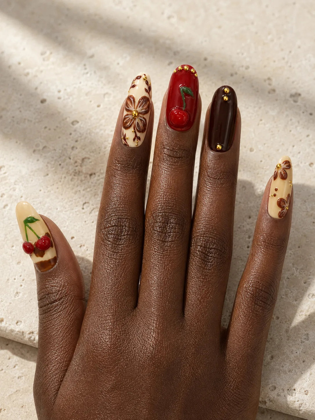 Cherry Cola Bloom Gold Stud Press-On Nails - hand1