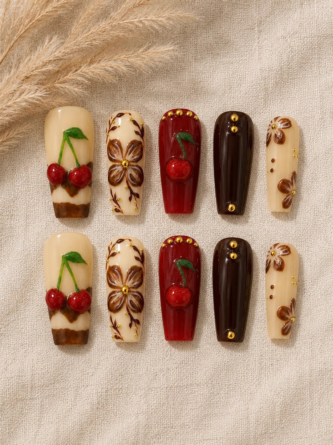 Cherry Cola Bloom Gold Stud Press-On Nails - flatlay