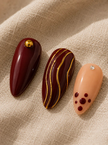 Gilded Burgundy Stripe Press-On Nails - closeup