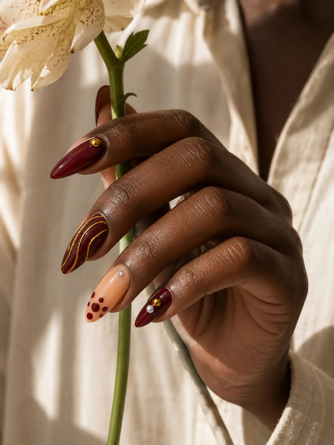 Gilded Burgundy Stripe Press-On Nails - life1