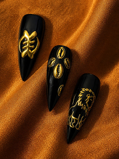 Lion Cowrie - Gold Relief Black Press-On Nails - closeup