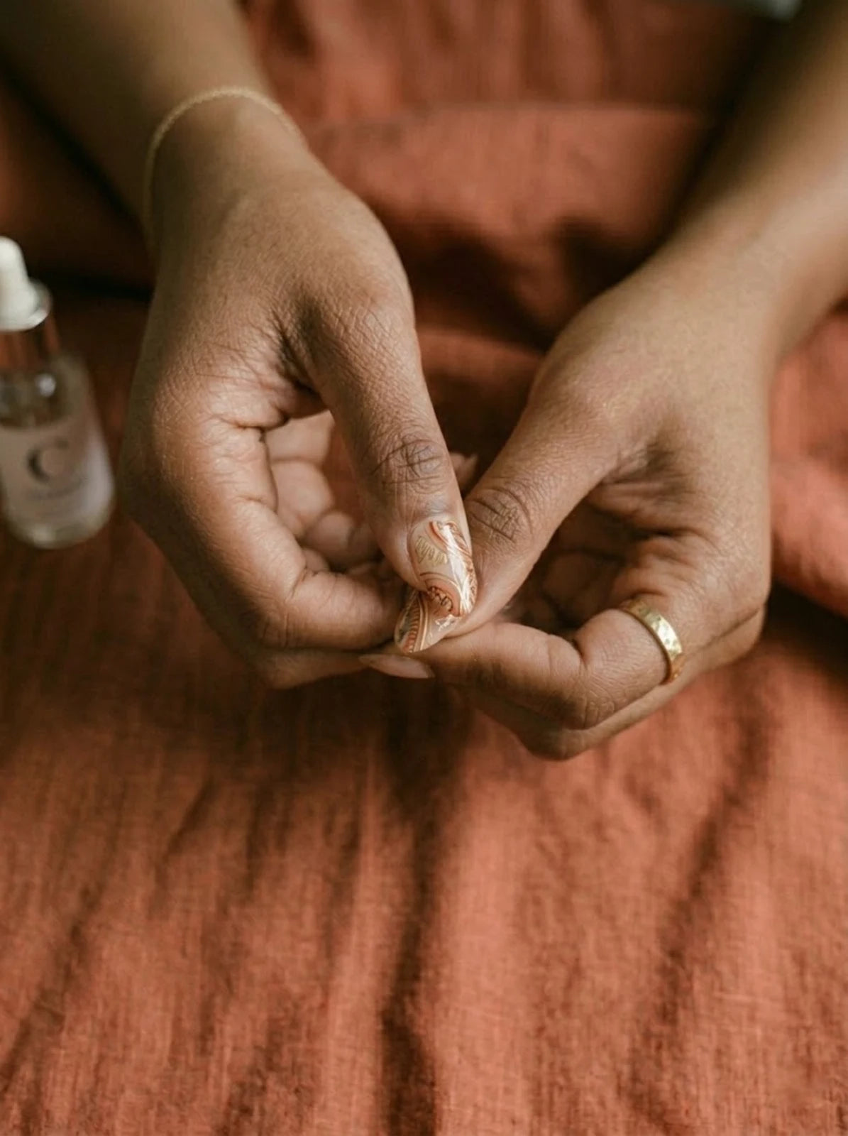 Press the nail at a 45 degree angle and hold firmly